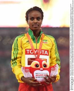 (150830) -- BEIJING, Aug. 30, 2015 -- Bronze medalist Genzebe Dibaba poses during the awarding ceremony of the women s 5000m event at the 2015 IAAF World Championships at the Bird s Nest National Stadium in Beijing, capital of China, Aug. 30, 2015. ) (SP)CHINA-BEIJING-IAAF WORLD CHAMPIONSHIPS-WOMEN S 5000M AWARDING CEREMONY (CN) YuexYuewei 