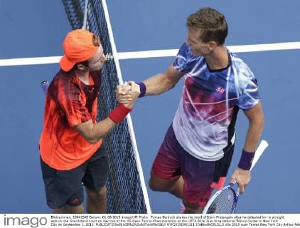 Tomas Berdych shakes the hand of Bjorn Fratangelo after he defeated hm in straight sets on the Grandstand court on day two at the US Open Tennis Championships at the USTA Billie Jean King National Tennis Center in New York City on September 1, 2015.  NYP20150901111 JOHNxANGELILLO