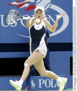 Caroline Wozniacki of Denmark hits a forehand to Jamie Loeb in their first round match in Arthur Ashe Stadium on day two at the US Open Tennis Championships at the USTA Billie Jean King National Tennis Center in New York City on September 1, 2015.  NYP20150901116 JOHNxANGELILLO