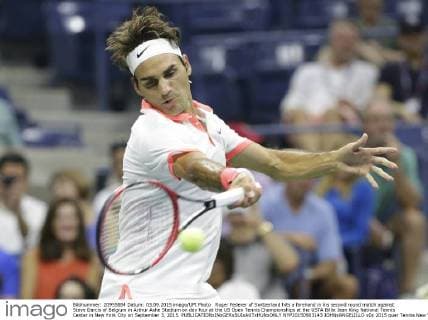 Roger Federer of Switzerland hits a forehand in his second round match against Steve Darcis of Belgium in Arthur Ashe Stadium on day four at the US Open Tennis Championships at the USTA Billie Jean King National Tennis Center in New York City on September 3, 2015.  NYP20150903143 JOHNxANGELILLO