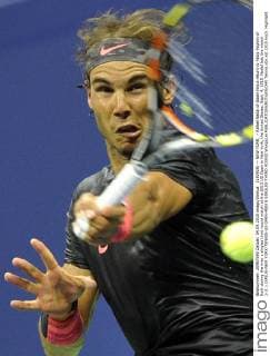 (150905) -- NEW YORK, - Rafael Nadal of Spain hits a return to Fabio Fognini of Italy during the men s singles third round match at the 2015 US Open in New York, the United States, Sept. 4, 2015. Nadal lost the match 2-3. ) (SP)US-NEW YORK-TENNIS-US OPEN-MEN S SINGLES-THIRD ROUND WangxLei 