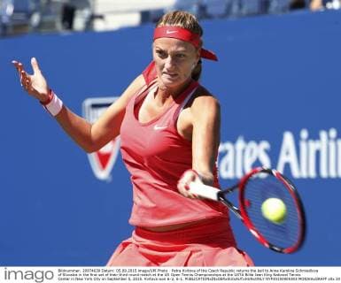 Petra Kvitova of the Czech Republic returns the ball to Anna Karolina Schmiedlova of Slovakia in the first set of their third round match at the US Open Tennis Championships at the USTA Billie Jean King National Tennis Center in New York City on September 5, 2015. Kvitova won 6-2, 6-1.  NYP20150905303 MONIKAxGRAFF
