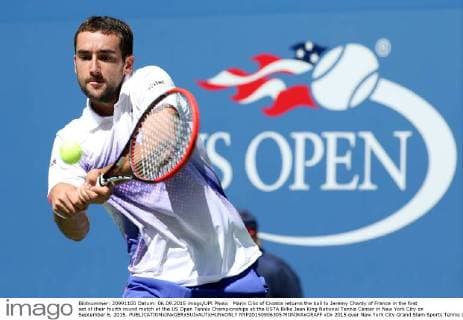 Marin Cilic of Croatia returns the ball to Jeremy Chardy of France in the first set of their fourth round match at the US Open Tennis Championships at the USTA Billie Jean King National Tennis Center in New York City on September 6, 2015.  NYP20150906305 MONIKAxGRAFF