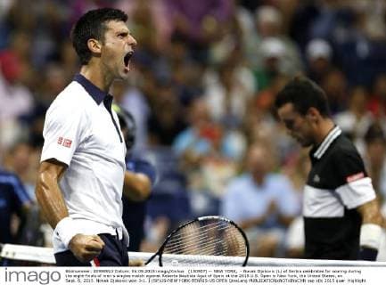 (150907) -- NEW YORK, - Novak Djokovic (L) of Serbia celebrates for scoring during the eight-finals of men s singles match against Roberto Bautista Agut of Spain at the 2015 U.S. Open in New York, the United States, on Sept. 6, 2015. Novak Djokovic won 3-1. ) (SP)US-NEW YORK-TENNIS-US OPEN QinxLang 