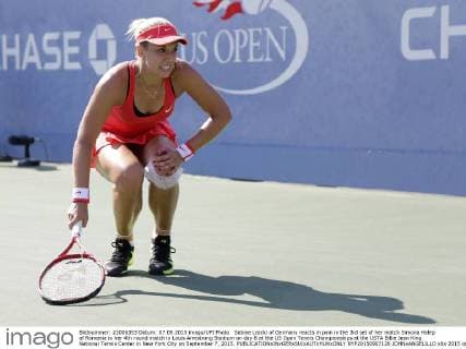 Sabine Lisicki of Germany reacts in pain in the 3rd set of her match Simona Halep of Romania in her 4th round match in Louis Armstrong Stadium on day 8 at the US Open Tennis Championships at the USTA Billie Jean King National Tennis Center in New York City on September 7, 2015.  NYP20150907126 JOHNxANGELILLO