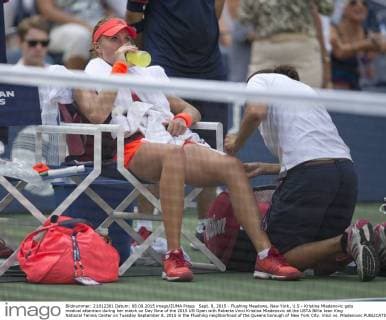 Sept. 8, 2015 - Flushing Meadows, New York, U.S - Kristina Mladenovic gets medical attention during her match on Day Nine of the 2015 US Open with Roberta Vinci Kristina Mladenovic at the USTA Billie Jean King National Tennis Center on Tuesday September 8, 2015 in the Flushing neighborhood of the Queens borough of New York City. Vinci vs. Mladenovic - ZUMAp124