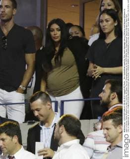 Kim Kardashian waits for the match between Venus Williams and Serena Williams to start in Arthur Ashe Stadium on day 9 at the US Open Tennis Championships at the USTA Billie Jean King National Tennis Center in New York City on September 8, 2015.  NYP20150908118 JOHNxANGELILLO