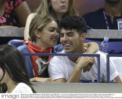 Joe Jonas and Gigi Hadid hold hands while Venus Williams plays Serena Williams in Arthur Ashe Stadium on day 9 at the US Open Tennis Championships at the USTA Billie Jean King National Tennis Center in New York City on September 8, 2015.  NYP20150908124 JOHNxANGELILLO