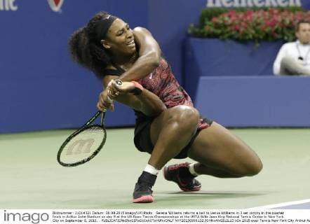 Serena Williams returns a ball to Venus Williams in 3 set victory in the quarter finals in Arthur Ashe Stadium on day 9 at the US Open Tennis Championships at the USTA Billie Jean King National Tennis Center in New York City on September 8, 2015. .  NYP20150908132 JOHNxANGELILLO