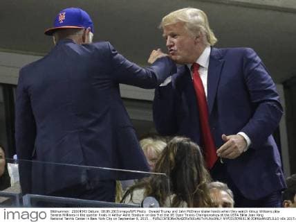 Donald Trump and John McEnroe shake hands when they watch Venus Williams play Serena Williams in the quarter finals in Arthur Ashe Stadium on day 9 at the US Open Tennis Championships at the USTA Billie Jean King National Tennis Center in New York City on September 8, 2015. .  NYP20150908136 JOHNxANGELILLO