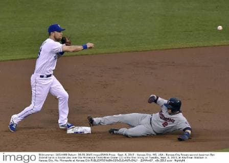 Sept. 8, 2015 - Kansas City, MO, USA - Kansas City Royals second baseman Ben Zobrist turns a double play over the Minnesota Twins Brian Dozier (2) in the first inning on Tuesday, Sept. 8, 2015, at Kauffman Stadium in Kansas City, Mo. Minnesota at Kansas City - ZUMAm67_
