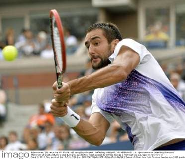 Defending champion Cilic advances to U.S. Open semifinals Defending champion Marin Cilic of Croatia returns a shot during his quarterfinal match against Jo-Wilfried Tsonga of France at the U.S. Open in New York on Sept. 8, 2015. Cilic won 6-4, 6-4, 3-6, 6-7(3), 6-4. 