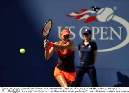 (150909) -- NEW YORK, Sept. 8, 2015 -- Kristina Mladenovic of France hits a return during the women s singles quarter-final match against Roberta Vinci of Italy at the 2015 US Open in New York, the United States, on Sept. 8, 2015. Kristina Mladenovic lost 1-2. ) (SP)US-NEW YORK-TENNIS-US OPEN WangxLei 