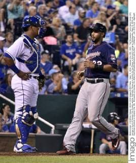 Sept. 9, 2015 - Kansas City, MO, USA - The Minnesota Twins Aaron Hicks (32) scores in front of Kansas City Royals catcher Salvador Perez on a double by Joe Mauer in the sixth inning on Wednesday, Sept. 9, 2015, at Kauffman Stadium in Kansas City, Mo. Minnesota at Kansas City - ZUMAm67_