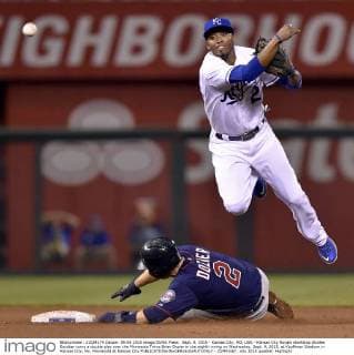 Sept. 9, 2015 - Kansas City, MO, USA - Kansas City Royals shortstop Alcides Escobar turns a double play over the Minnesota Twins Brian Dozier in the eighth inning on Wednesday, Sept. 9, 2015, at Kauffman Stadium in Kansas City, Mo. Minnesota at Kansas City - ZUMAm67_