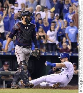 Sept. 9, 2015 - Kansas City, MO, USA - The Kansas City Royals Ben Zobrist scores behind Minnesota Twins catcher Kurt Suzuki on a sacrifice fly by Lorenzo Cain to tie the game in the eighth inning on Wednesday, Sept. 9, 2015, at Kauffman Stadium in Kansas City, Mo. Minnesota at Kansas City - ZUMAm67_
