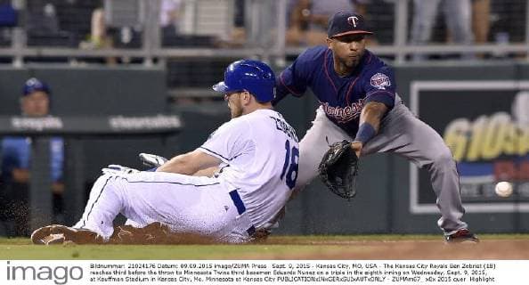 Sept. 9, 2015 - Kansas City, MO, USA - The Kansas City Royals Ben Zobrist (18) reaches third before the throw to Minnesota Twins third baseman Eduardo Nunez on a triple in the eighth inning on Wednesday, Sept. 9, 2015, at Kauffman Stadium in Kansas City, Mo. Minnesota at Kansas City - ZUMAm67_