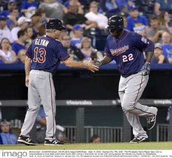 Sept. 9, 2015 - Kansas City, MO, USA - The Minnesota Twins Miguel Sano (22) is congratulated by third base coach Gene Glynn after hitting a solo home run in the 12th inning against the Kansas City Royals on Wednesday, Sept. 9, 2015, at Kauffman Stadium in Kansas City, Mo. Minnesota at Kansas City - ZUMAm67_