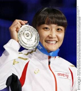 Japan s Icho claims 10th world wrestling title Japan s Kaori Icho smiles with her gold medal after beating Petra Olli of Finland in the women s 58-kilogram division final at the world wrestling championships in Las Vegas on Sept. 10, 2015. Icho won her 10th world title. 