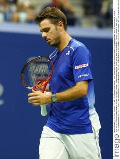 Stan Wawrinka of Switzerland takes on Roger Federer, also of Switzerland, in the first set of their semi-final match at the US Open Tennis Championships at the USTA Billie Jean King National Tennis Center in New York City on September 11, 2015.  NYP20150911315 MONIKAxGRAFF