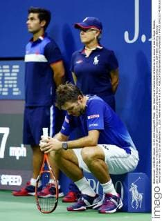 Stan Wawrinka of Switzerland reflects as he is about to lose to Roger Federer, also of Switzerland, in the third set of their semi-final match at the US Open Tennis Championships at the USTA Billie Jean King National Tennis Center in New York City on September 11, 2015. Federer won 6-4, 6-3, 6-1.  NYP20150911327 MONIKAxGRAFF