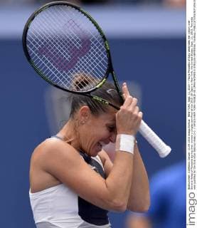 NEW YORK, Sept. 11, 2015 -- Flavia Pennetta of Italy celebrates her victory over Simona Halep of Romania during their women s singles semifinal at the 2015 US Open in New York, the United States, Sept. 11, 2015. Pennetta was qualified for the final after beating Halep 2-0. ) (SP)US-NEW YORK-TENNIS-US OPEN-WOMEN S SINGLES-SEMIFINAL YinxBogu 
