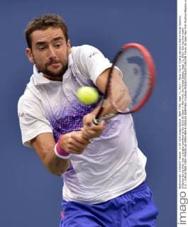 NEW YORK, Sept. 11, 2015 -- Marin Cilic of Croatia returns a shot to Novak Djokovic of Serbia during their men s singles semifinal at the 2015 US Open in New York, the United States, Sept. 11, 2015. Cilic lost the match 0-3. ) (SP)US-NEW YORK-TENNIS-US OPEN-MEN S SINGLES-SEMIFINAL YinxBogu 