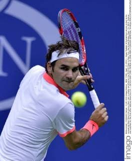 NEW YORK, Sept. 11, 2015 -- Roger Federer of Switzerland returns a shot to his compatriot Stan Wawrinka during their men s singles semifinal at the 2015 US Open in New York, the United States, Sept. 11, 2015. Federer was qualified for the final after beating Wawrinka 3-0. ) (SP)US-NEW YORK-TENNIS-US OPEN-MEN S SINGLES-SEMIFINAL YinxBogu 