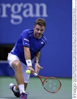 NEW YORK, Sept. 11, 2015 -- Stan Wawrinka of Switzerland returns a shot to his compatriot Roger Federer during their men s singles semifinal at the 2015 US Open in New York, the United States, Sept. 11, 2015. Wawrinka lost the match 0-3. ) (SP)US-NEW YORK-TENNIS-US OPEN-MEN S SINGLES-SEMIFINAL YinxBogu 