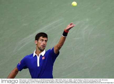 NEW YORK, Sept. 11, 2015 -- Novak Djokovic of Serbia serves to Marin Cilic of Croatia during their men s singles semifinal at the 2015 US Open in New York, the United States, Sept. 11, 2015. Djokovic was qualified for the final after beating Cilic 3-0. ) (SP)US-NEW YORK-TENNIS-US OPEN-MEN S SINGLES-SEMIFINAL QinxLang 