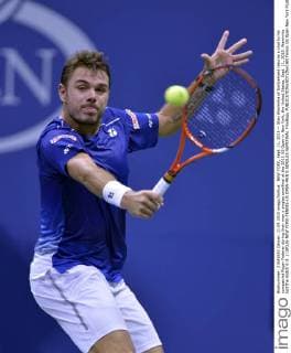 NEW YORK, Sept. 11, 2015 -- Stan Wawrinka of Switzerland returns a shot to his compatriot Roger Federer during their men s singles semifinal at the 2015 US Open in New York, the United States, Sept. 11, 2015. Wawrinka lost the match 0-3. ) (SP)US-NEW YORK-TENNIS-US OPEN-MEN S SINGLES-SEMIFINAL YinxBogu 