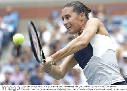 Flavia Pennetta of Italy hits a backhand to Roberta Vinci of Italy in the Women s Final in Arthur Ashe Stadium at the US Open Tennis Championships at the USTA Billie Jean King National Tennis Center in New York City on September 12, 2015.  NYP20150912110 JOHNxANGELILLO