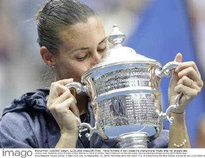 Flavia Pennetta of Italy kisses the championship Trophy after her straight sets victory over Roberta Vinci of Italy in the Women s Final in Arthur Ashe Stadium at the US Open Tennis Championships at the USTA Billie Jean King National Tennis Center in New York City on September 12, 2015. Pennetta wins the match 7-6, 6-2 becoming the first Italian women to win a US Open and also announced her retirement at the Trophy Ceremony.  NYP20150912118 JOHNxANGELILLO