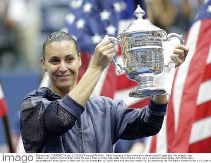 Flavia Pennetta of Italy holds the championship Trophy after her straight sets victory over Roberta Vinci of Italy in the Women s Final in Arthur Ashe Stadium at the US Open Tennis Championships at the USTA Billie Jean King National Tennis Center in New York City on September 12, 2015. Pennetta wins the match 7-6, 6-2 becoming the first Italian women to win a US Open and also announced her retirement at the Trophy Ceremony.  NYP20150912134 JOHNxANGELILLO