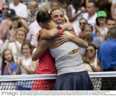Sept. 12, 2015 - Flushing Meadows, New York, U.S - Flavia Pennetta hugs Roberta Vinci (Red) after their match on Day 13 of the 2015 US Open at the USTA Billie Jean King National Tennis Center on Saturday September 12, 2015 in the Flushing neighborhood of the Queens borough of New York City. Pennetta won by a score of 7-6(7-4), 6-2. Pennetta vs. Vinci - ZUMAp124