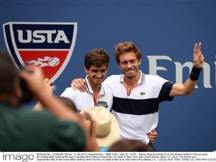 NEW YORK, Sept.12, 2015 -- Pierre-Hugues Herbert (L) and Nicolas Mahut of France pose for photos after winning the men s doubles final match at the 2015 US Open in New York, the United States, Sept. 12, 2015. The French pair claimed the title of the event after beating Jamie Murray of Great Britain and John Peers of Australia 2-0. ) (SP)US-NEW YORK-TENNIS-US OPEN-MEN S DOUBLES-FINAL YinxBogu 