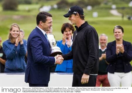 Zandvoort - Thomas Pieters has won KLM Open 2015 and becoming the 96th winner of the golf tournament. Photo: Thomas Pieters receives the trophy from KLM president Pieter Elbers. Photographer: Robert Meerding 
