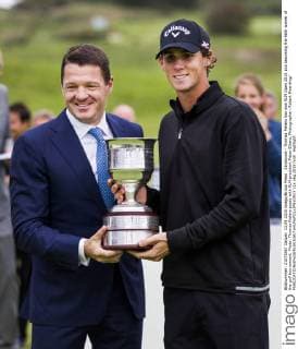 Zandvoort - Thomas Pieters has won KLM Open 2015 and becoming the 96th winner of the golf tournament. Photo: Thomas Pieters poses with KLM president Pieter Elbers. Photographer: Robert Meerding 