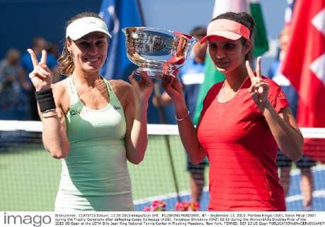 FLUSHING MEADOWS, NY - September 13, 2015: Martina Hingis (SUI), Sania Mirza (IND) during the Trophy Ceremony after defeating Casey Dellacqua (AUS), Yaroslava Shvedova (KAZ) 63 63 during the WomenâÄ?s Doubles Final of the 2015 US Open at the USTA Billy Jean King National Tennis Center in Flushing Meadows, New York. TENNIS: SEP 13 US Open Icon150913056 EDITORIAL USE ONLY