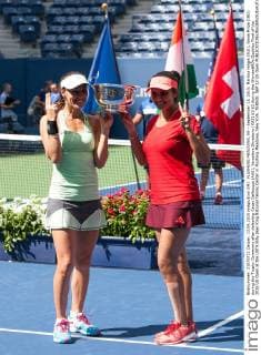 FLUSHING MEADOWS, NY - September 13, 2015: Martina Hingis (SUI), Sania Mirza (IND) during the Trophy Ceremony after defeating Casey Dellacqua (AUS), Yaroslava Shvedova (KAZ) 63 63 during the WomenâÄ?s Doubles Final of the 2015 US Open at the USTA Billy Jean King National Tennis Center in Flushing Meadows, New York. TENNIS: SEP 13 US Open Icon150913058 EDITORIAL USE ONLY