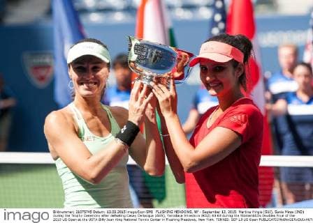 FLUSHING MEADOWS, NY - September 13, 2015: Martina Hingis (SUI), Sania Mirza (IND) during the Trophy Ceremony after defeating Casey Dellacqua (AUS), Yaroslava Shvedova (KAZ) 63 63 during the WomenâÄ?s Doubles Final of the 2015 US Open at the USTA Billy Jean King National Tennis Center in Flushing Meadows, New York. TENNIS: SEP 13 US Open Icon150913050 EDITORIAL USE ONLY