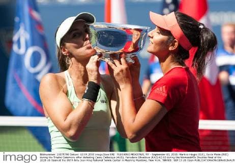 FLUSHING MEADOWS, NY - September 13, 2015: Martina Hingis (SUI), Sania Mirza (IND) during the Trophy Ceremony after defeating Casey Dellacqua (AUS), Yaroslava Shvedova (KAZ) 63 63 during the WomenâÄ?s Doubles Final of the 2015 US Open at the USTA Billy Jean King National Tennis Center in Flushing Meadows, New York. TENNIS: SEP 13 US Open Icon150913047 EDITORIAL USE ONLY