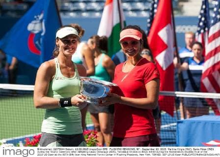 FLUSHING MEADOWS, NY - September 13, 2015: Martina Hingis (SUI), Sania Mirza (IND) during the Trophy Ceremony after defeating Casey Dellacqua (AUS), Yaroslava Shvedova (KAZ) 63 63 during the WomenâÄ?s Doubles Final of the 2015 US Open at the USTA Billy Jean King National Tennis Center in Flushing Meadows, New York. TENNIS: SEP 13 US Open Icon150913041 EDITORIAL USE ONLY