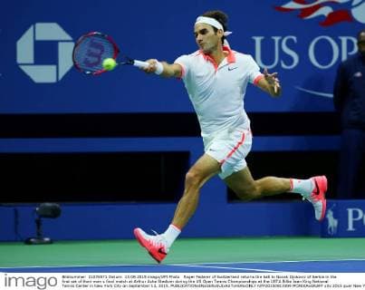 Roger Federer of Switzerland returns the ball to Novak Djokovic of Serbia in the first set of their men s final match at Arthur Ashe Stadium during the US Open Tennis Championships at the USTA Billie Jean King National Tennis Center in New York City on September 13, 2015.  NYP20150913309 MONIKAxGRAFF