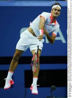 Roger Federer of Switzerland serves to Novak Djokovic of Serbia in the first set of their men s final match at Arthur Ashe Stadium during the US Open Tennis Championships at the USTA Billie Jean King National Tennis Center in New York City on September 13, 2015.  NYP20150913311 MONIKAxGRAFF