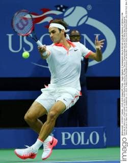 Roger Federer of Switzerland returns the ball to Novak Djokovic of Serbia in the first set of their men s final match at Arthur Ashe Stadium during the US Open Tennis Championships at the USTA Billie Jean King National Tennis Center in New York City on September 13, 2015.  NYP20150913315 MONIKAxGRAFF