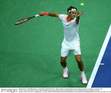 Roger Federer of Switzerland serves to Novak Djokovic of Serbia in the third set of their men s final match at Arthur Ashe Stadium during the US Open Tennis Championships at the USTA Billie Jean King National Tennis Center in New York City on September 13, 2015.  NYP20150913319 MONIKAxGRAFF