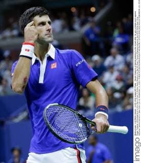 Novak Djokovic of Serbia motions to the crowd after he won a break point against Roger Federer of Switzerland in the Men s Final in Arthur Ashe Stadium at the US Open Tennis Championships at the USTA Billie Jean King National Tennis Center in New York City on September 13, 2015.  NYP20150913822 RAYxSTUBBLEBINE