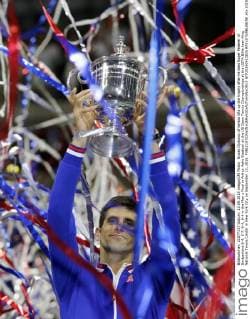 Novak Djokovic of Serbia lifts up the trophy after he beat Roger Federer of Switzerland 6-4, 5-7, 6-4, 6-4 in the Men s Final in Arthur Ashe Stadium at the US Open Tennis Championships at the USTA Billie Jean King National Tennis Center in New York City on September 13, 2015.  NYP20150913825 RAYxSTUBBLEBINE