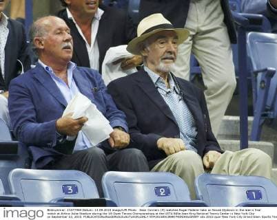 Sean Connery (R) watches Roger Federer take on Novak Djokovic in the men s final match at Arthur Ashe Stadium during the US Open Tennis Championships at the USTA Billie Jean King National Tennis Center in New York City on September 13, 2015.  NYP20150913999 MONIKAxGRAFF